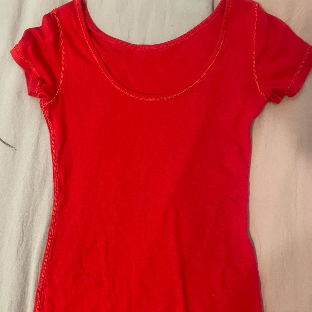 red shirt with stitching on the outside